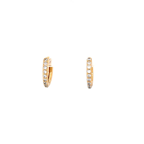 A pair of slim Rose gold Zirconia stones Huggies earrings, featuring a huggie-style design with small, sparkling zirconia stones on 14k rose-filled metal gold hoops, isolated on a white background.